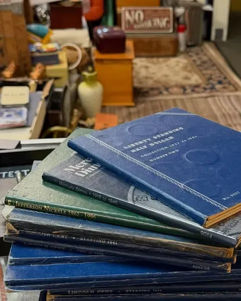 Counter shot: A stack of coin folders waiting to be checked