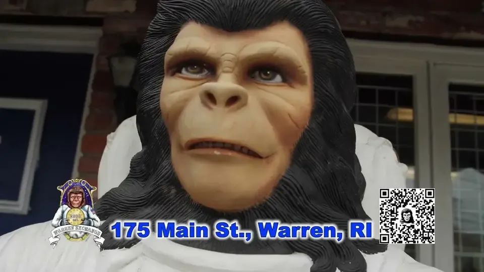 Zippy the space monkey in the Warren Exchange TV commercial, with the shop address on screen