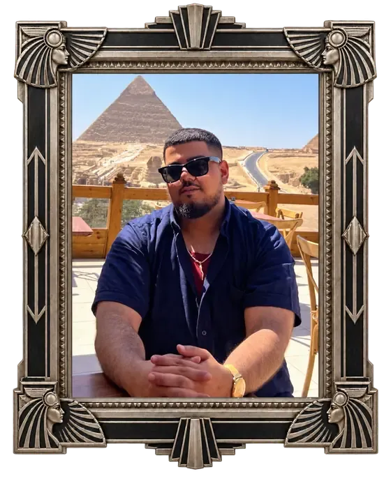 Zaza, Warren Exchange Whatnot host and coin enthusiast, seated with the pyramids behind him.